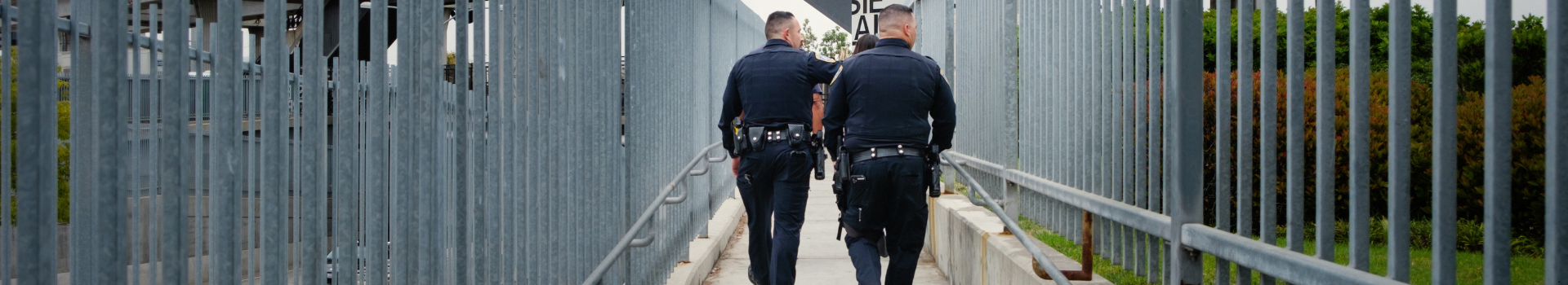 PATCHES officers walking in overpass